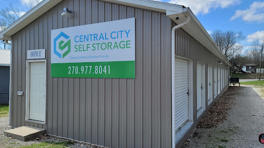 Central City Self Storage office building with its sign and white roll-up unit doors